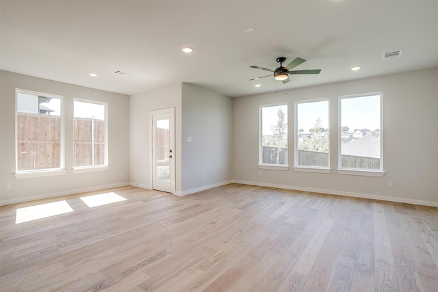 unfurnished living room with light hardwood / wood-style flooring and ceiling fan