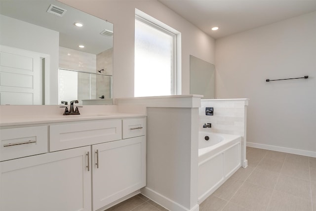 bathroom featuring vanity and plus walk in shower