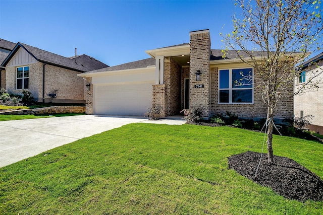 view of front of property with a front yard and a garage