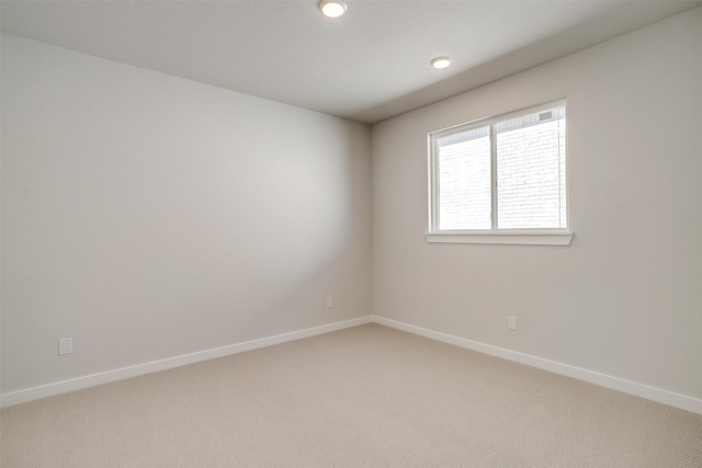 unfurnished room featuring carpet