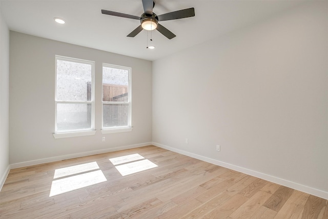 unfurnished room featuring light wood-type flooring and ceiling fan