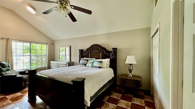 tiled bedroom featuring high vaulted ceiling, a closet, and ceiling fan