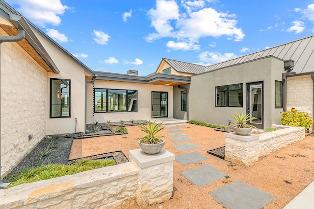 rear view of property with a patio area