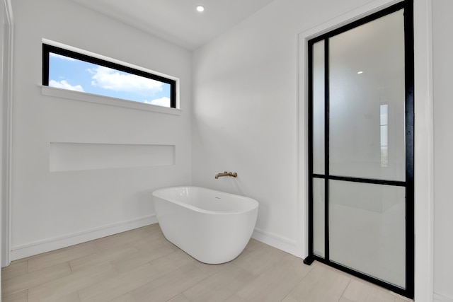 bathroom featuring a tub