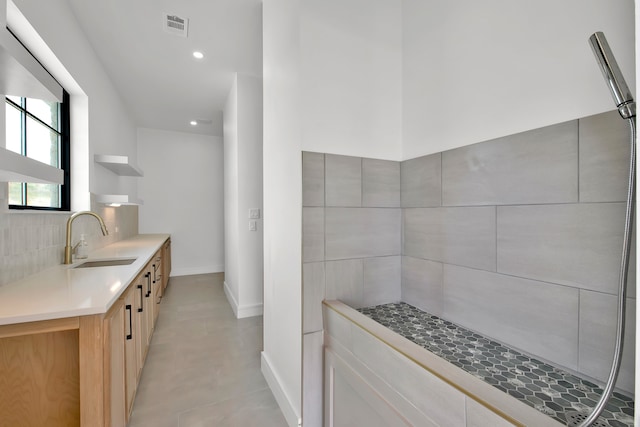 kitchen featuring light brown cabinetry and sink