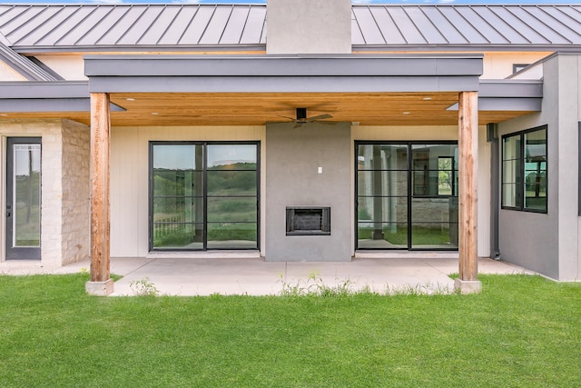 back of house featuring a patio, a yard, and ceiling fan