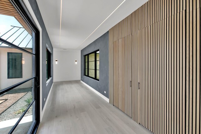 corridor featuring light hardwood / wood-style flooring