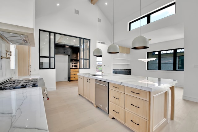 kitchen with pendant lighting, high vaulted ceiling, and a wealth of natural light