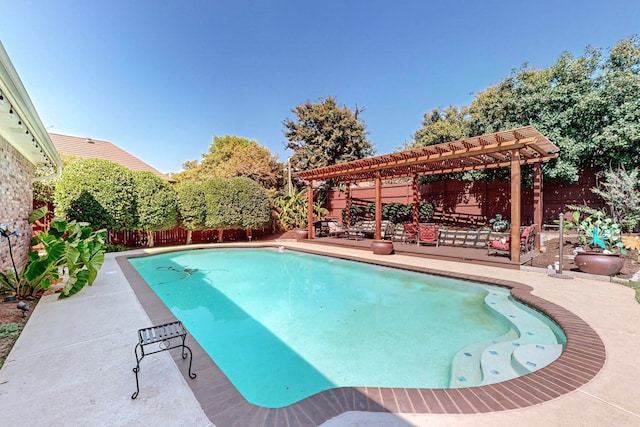 view of pool with a pergola and a patio