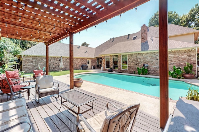 view of swimming pool featuring a pergola