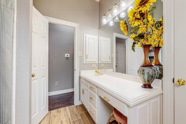 bathroom featuring vanity and hardwood / wood-style flooring