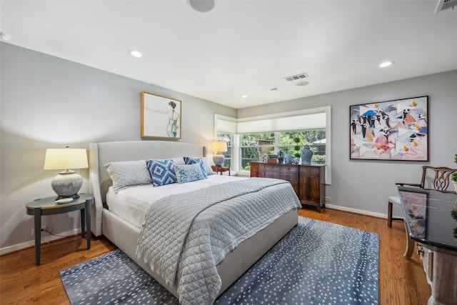 bedroom featuring hardwood / wood-style floors