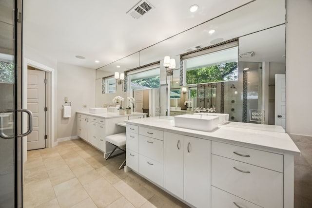 5332 Edmondson Ave, Dallas, TX 75209 - full bath featuring a shower stall, two vanities, tile patterned flooring, recessed lighting, and baseboards