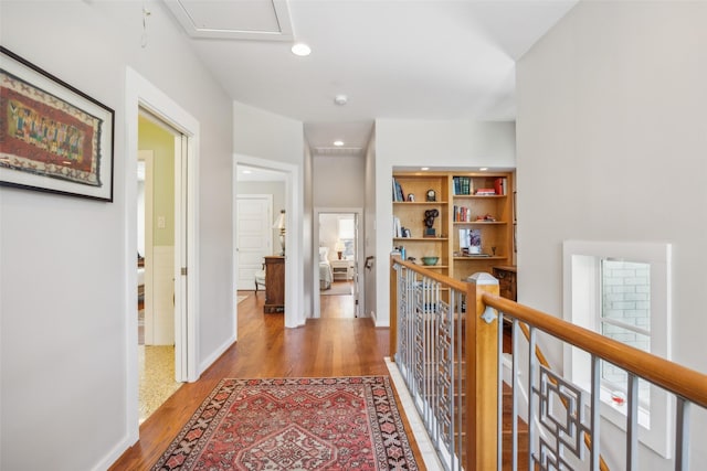 5332 Edmondson Ave, Dallas, TX 75209 - hallway with wood finished floors, recessed lighting, an upstairs landing, and baseboards
