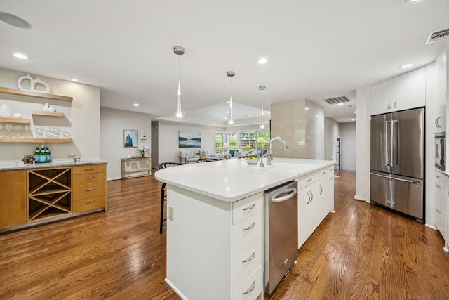 5332 Edmondson Ave, Dallas, TX 75209 - kitchen featuring stainless steel appliances, a sink, wood finished floors, modern cabinets, and recessed lighting