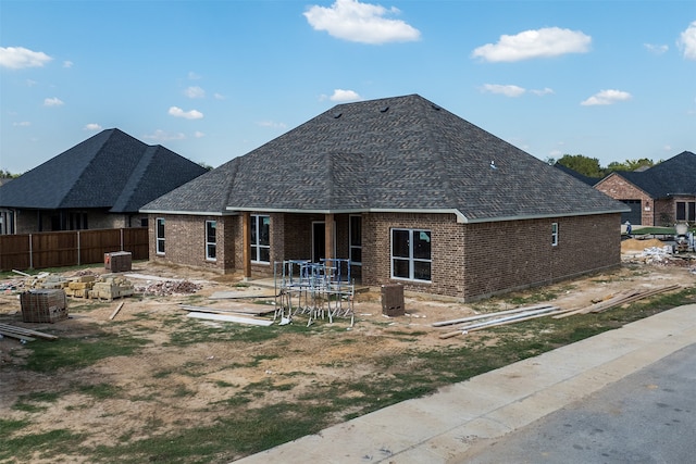 back of property featuring cooling unit and a patio