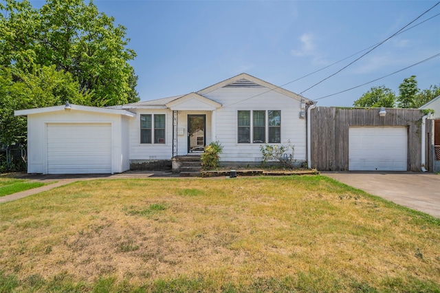 single story home with a garage and a front yard