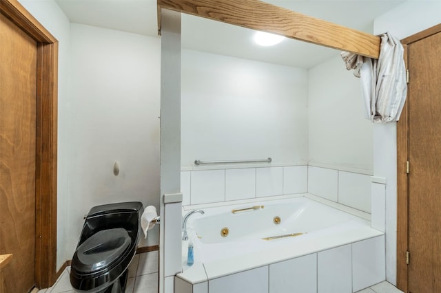 bathroom with tiled tub and toilet