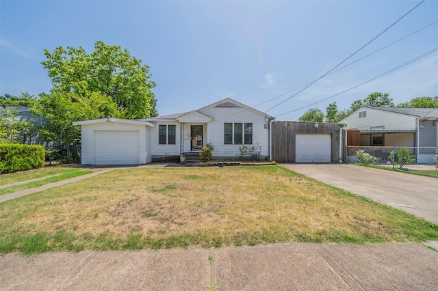 ranch-style home with a front yard and a garage