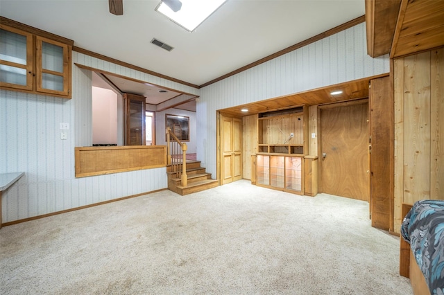 unfurnished living room featuring light colored carpet