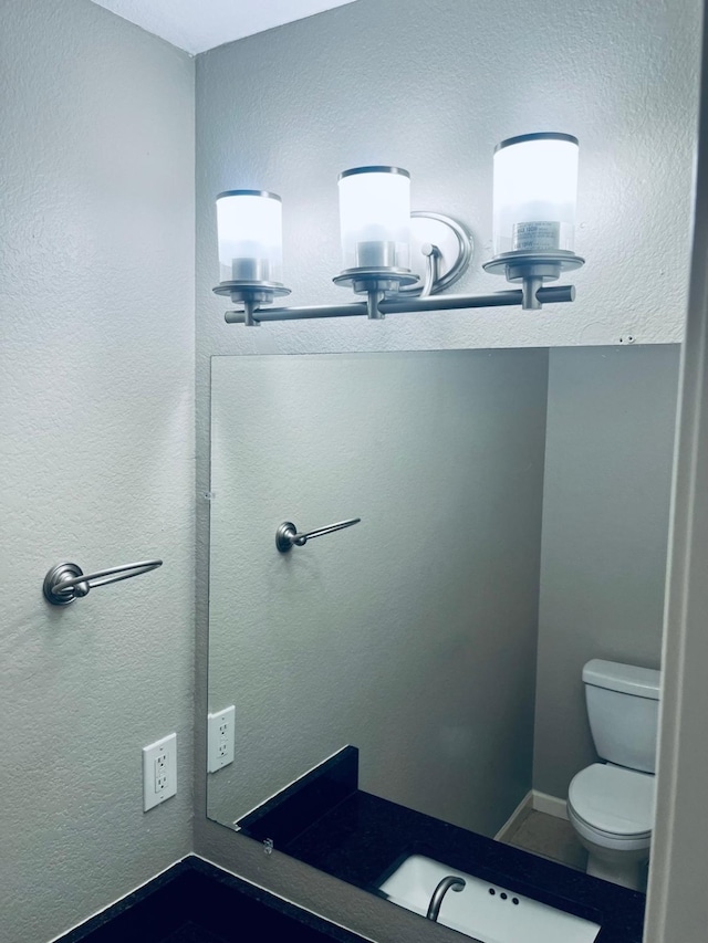 bathroom with sink and toilet