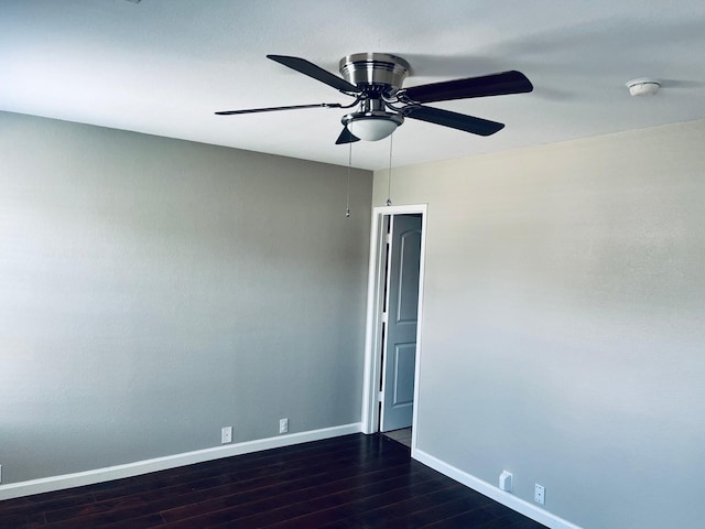 spare room featuring hardwood / wood-style flooring and ceiling fan