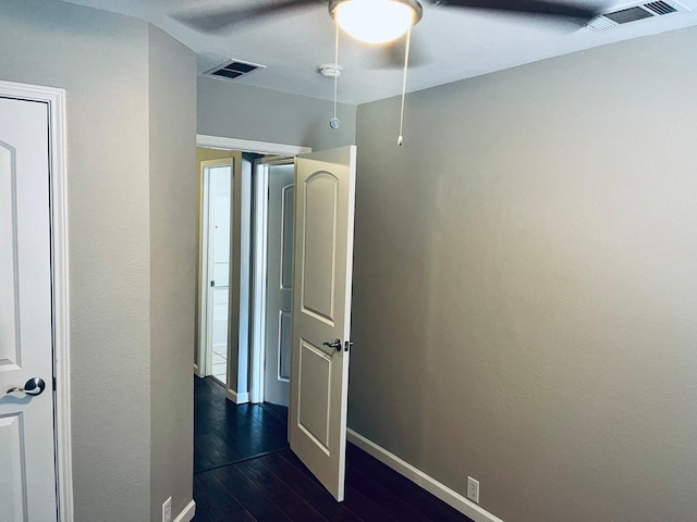 hallway featuring dark hardwood / wood-style flooring