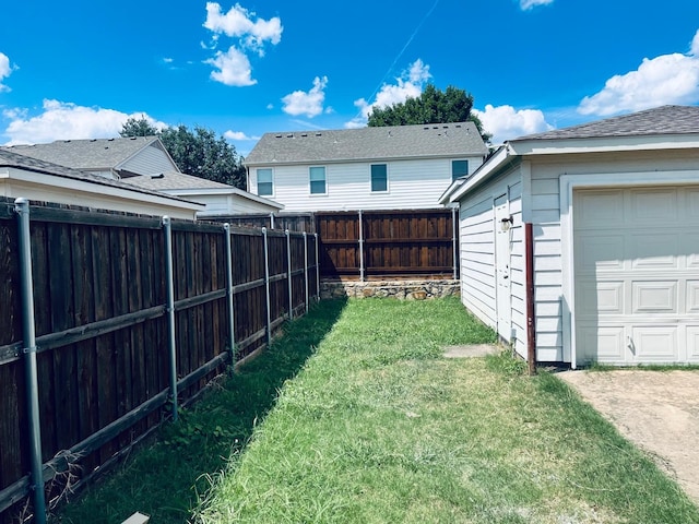 view of yard featuring a garage