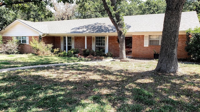 ranch-style house featuring a front lawn