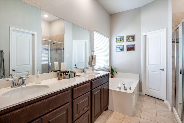 bathroom with vanity, shower with separate bathtub, and tile patterned flooring