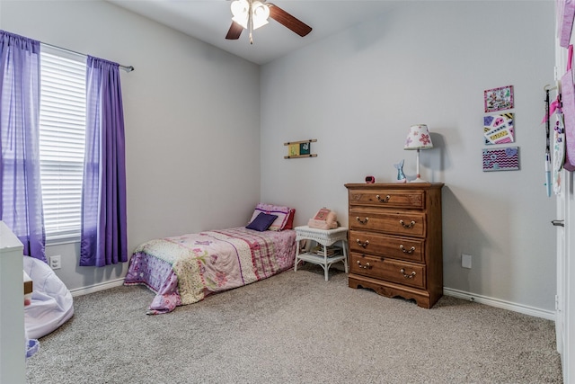 bedroom with ceiling fan and light carpet