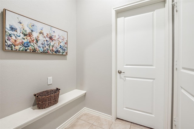 interior space with light tile patterned floors