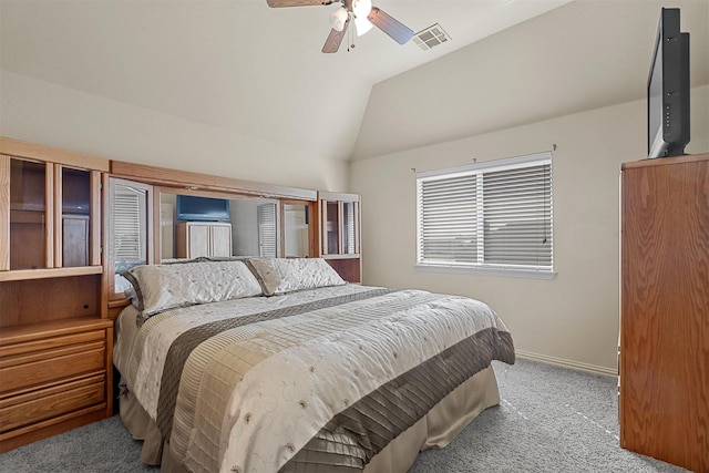 carpeted bedroom with lofted ceiling and ceiling fan