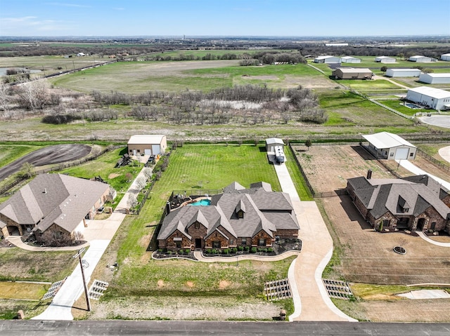 birds eye view of property featuring a rural view