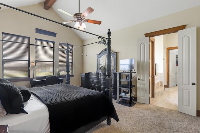 carpeted bedroom with ceiling fan, lofted ceiling with beams, and ensuite bath