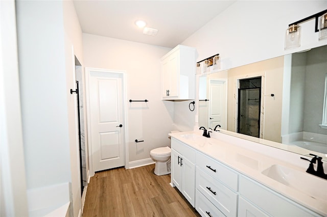 1412 Mason St, Bowie, TX 76230 - full bath with a shower stall, wood finished floors, double vanity, toilet, and baseboards