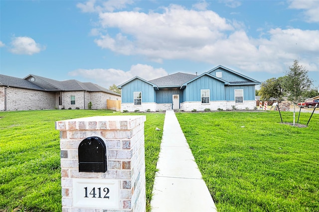 view of front of home with a front yard