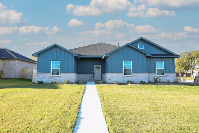 1412 Mason St, Bowie, TX 76230 - view of front facade featuring board and batten siding, brick siding, and roof with shingles