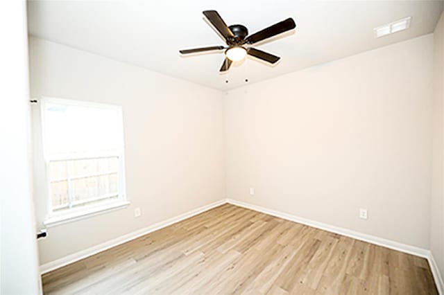 1412 Mason St, Bowie, TX 76230 - empty room featuring light wood-type flooring, baseboards, and a ceiling fan