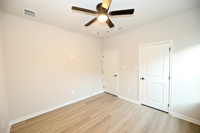 unfurnished bedroom featuring ceiling fan and light wood-type flooring