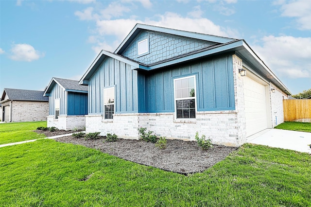 1412 Mason St, Bowie, TX 76230 - view of front of property with board and batten siding, driveway, and an attached garage