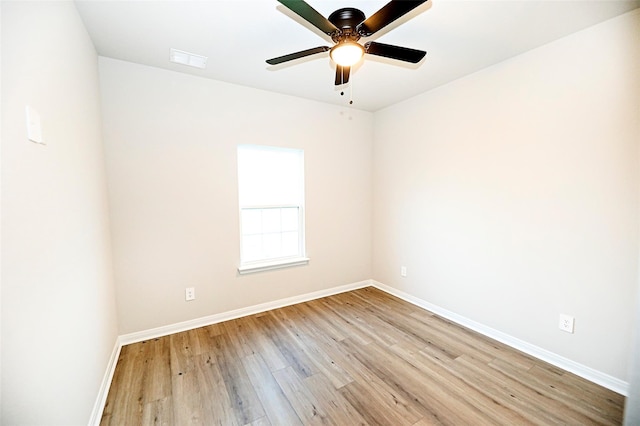 empty room featuring light wood-type flooring and ceiling fan