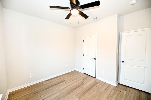 unfurnished bedroom with ceiling fan and light hardwood / wood-style floors