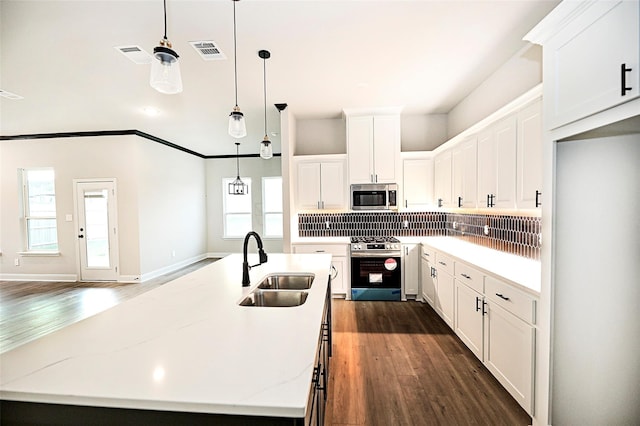 1412 Mason St, Bowie, TX 76230 - kitchen featuring stainless steel appliances, a sink, decorative backsplash, dark wood-style floors, and recessed lighting