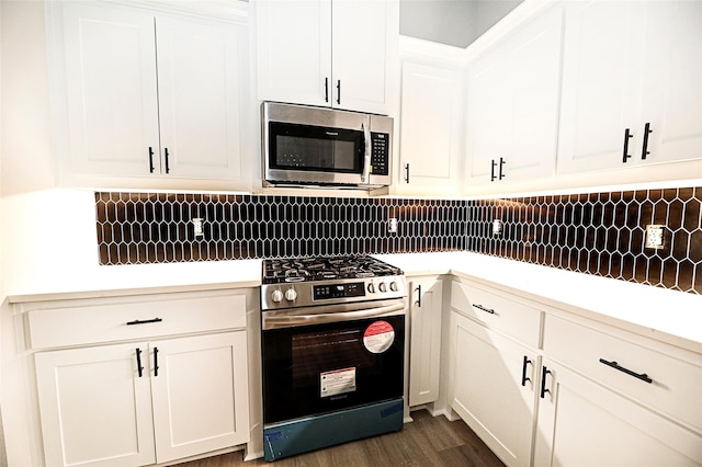 kitchen featuring white cabinets and appliances with stainless steel finishes