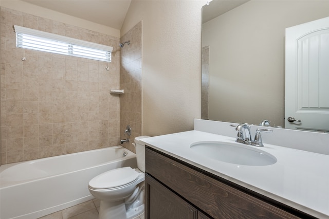 full bathroom featuring tiled shower / bath combo, vanity, tile patterned flooring, and toilet