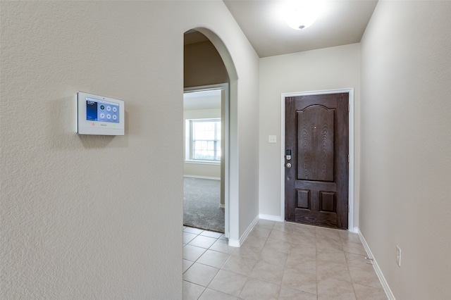 foyer featuring light tile patterned flooring