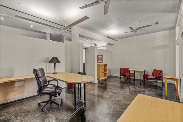 office area with concrete flooring and ceiling fan