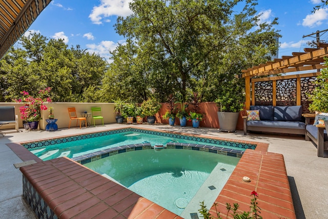 view of pool with an in ground hot tub, a patio area, and a pergola