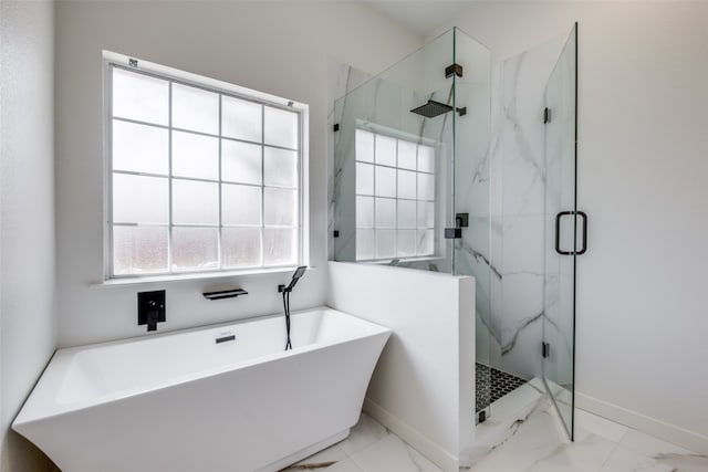 bathroom with tile patterned floors and separate shower and tub